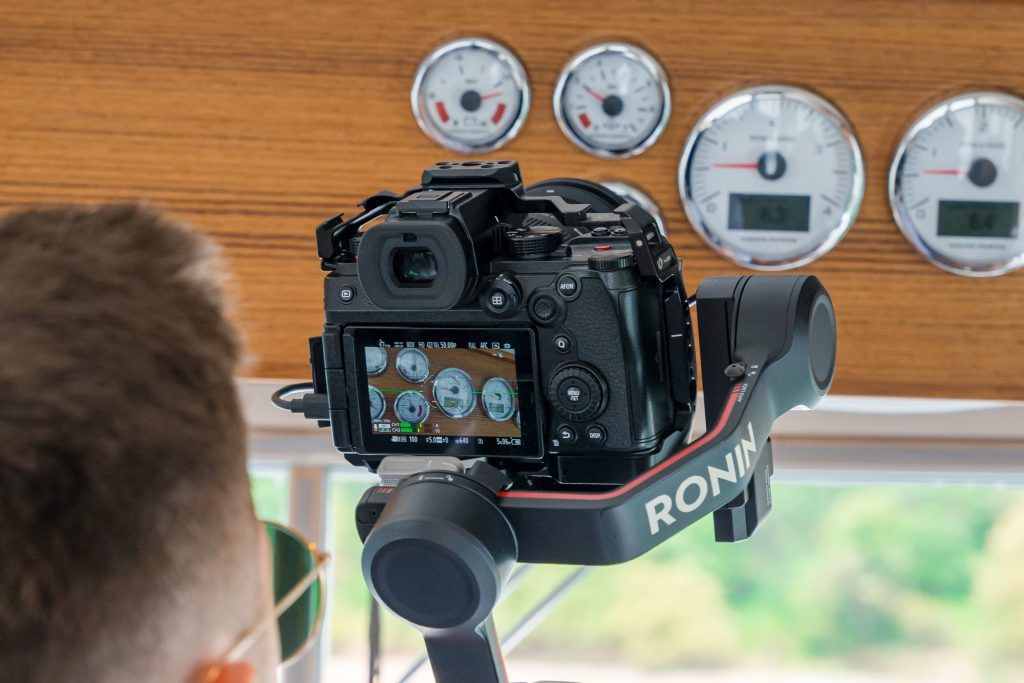Camera filming dials on a boat dashboard