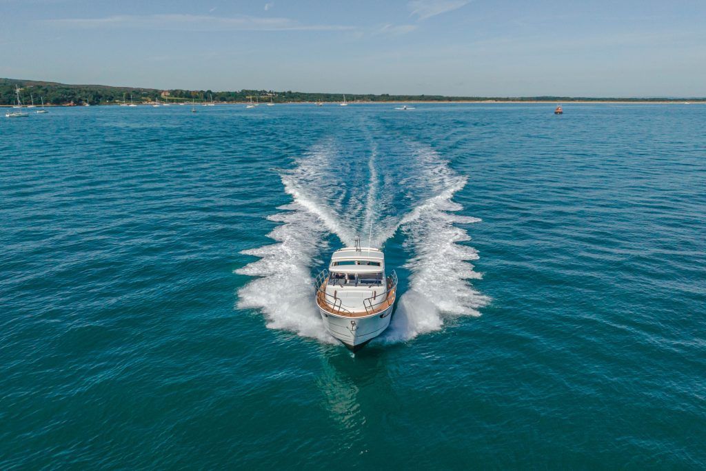 Boat speeding towards camera at sea