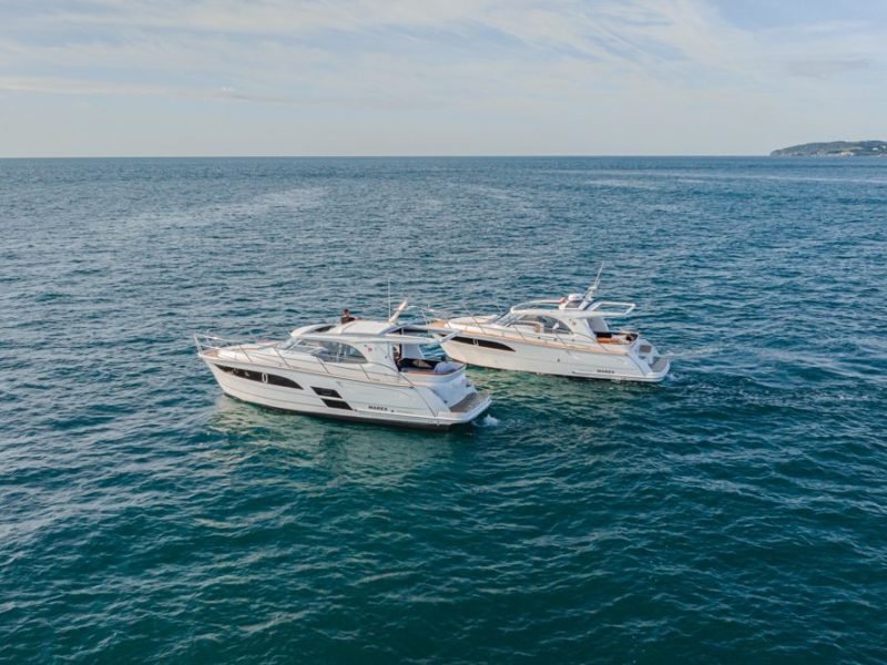 Two boats anchored next to each other