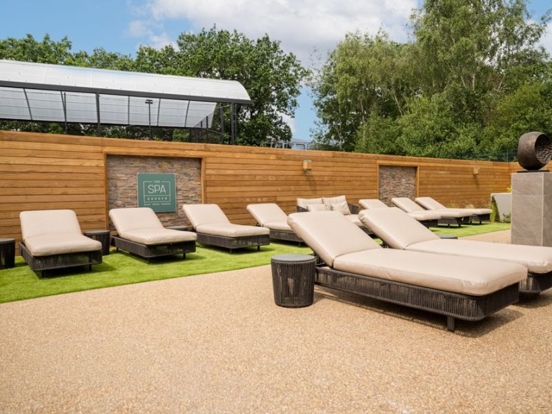 Relaxing spa outside space with sun loungers