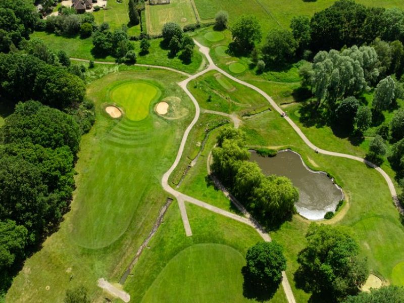 Drone picture of a golf course showing a green and fairway