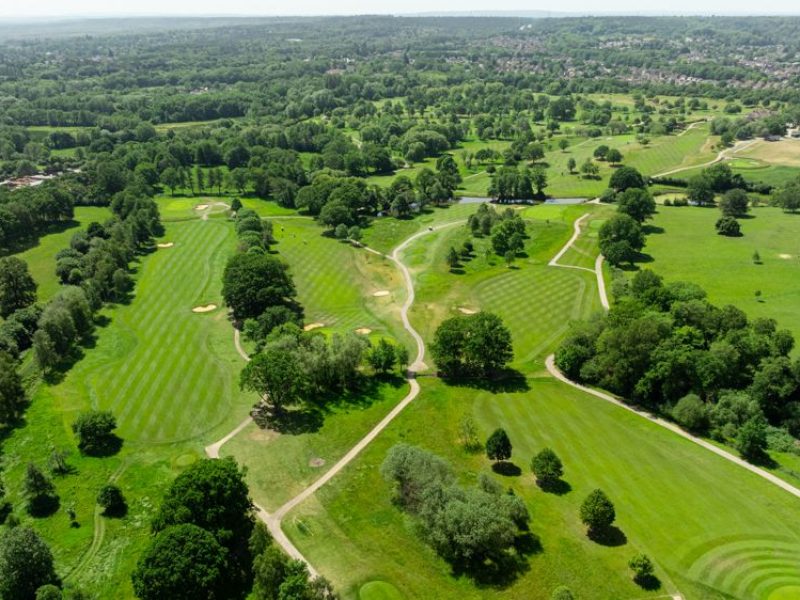 Aerial picture of a golf course with fairway lines